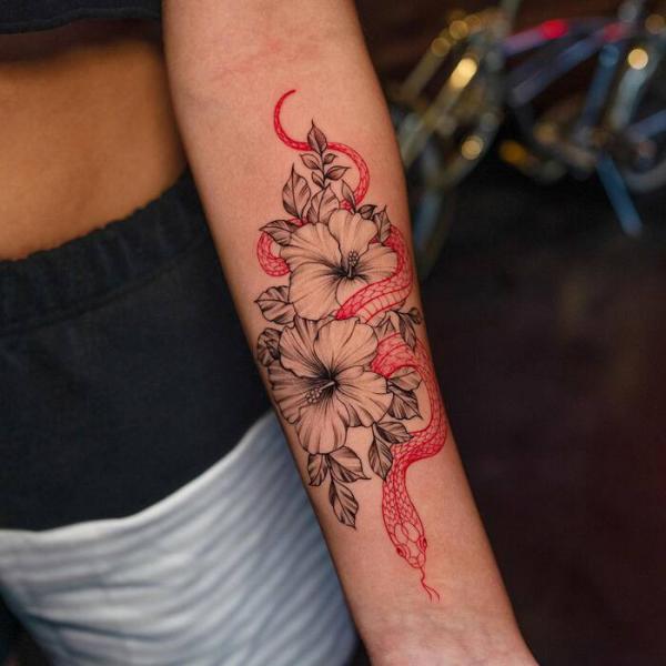 Black and grey hibiscus and red snake tattoo