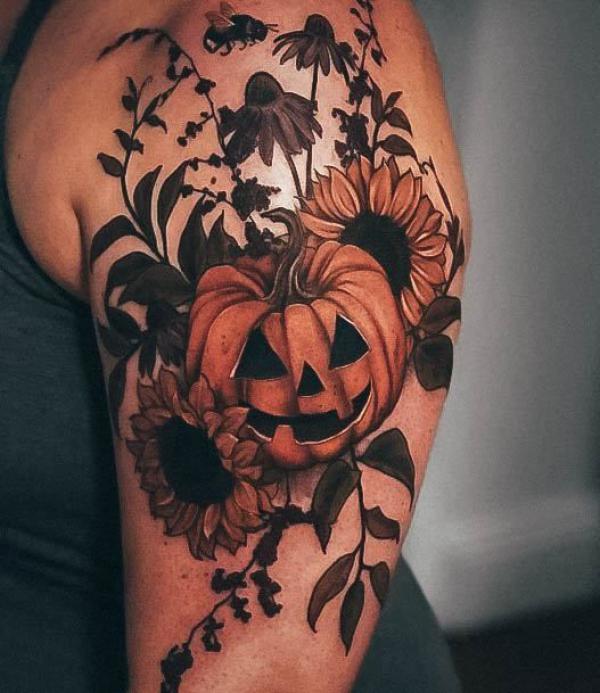 Carved pumpkin with sunflower tattoo