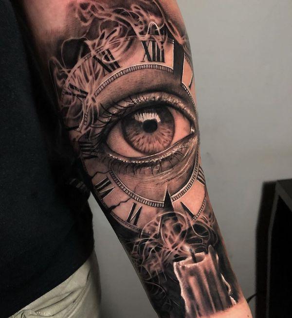 Clock and eye tattoo with a candle