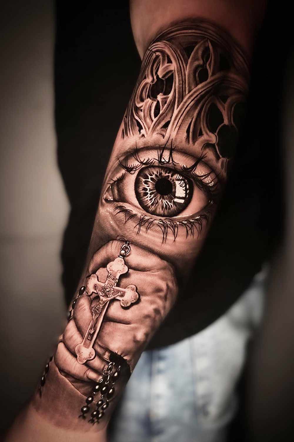 Eye and cross half sleeve tattoo