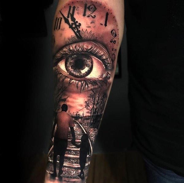 Family tattoo with father holding hand of child under eye