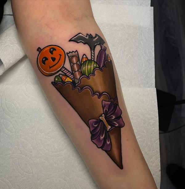 Gift of a candy with pumpkin face