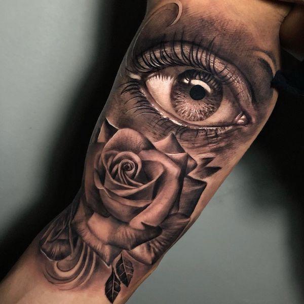 Half sleeve tattoo with eye and rose