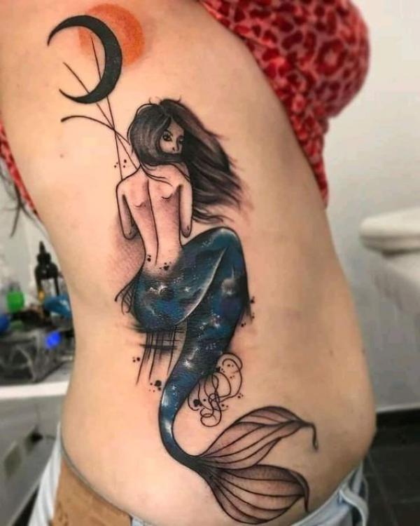 Mermaid and crescent moon side tattoo
