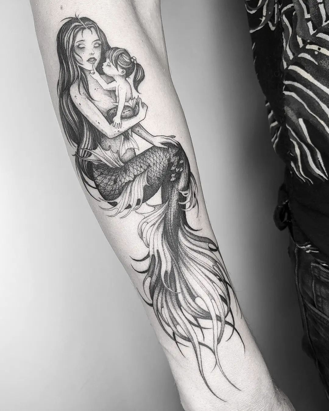 Mermaid forearm tattoo in sketch style