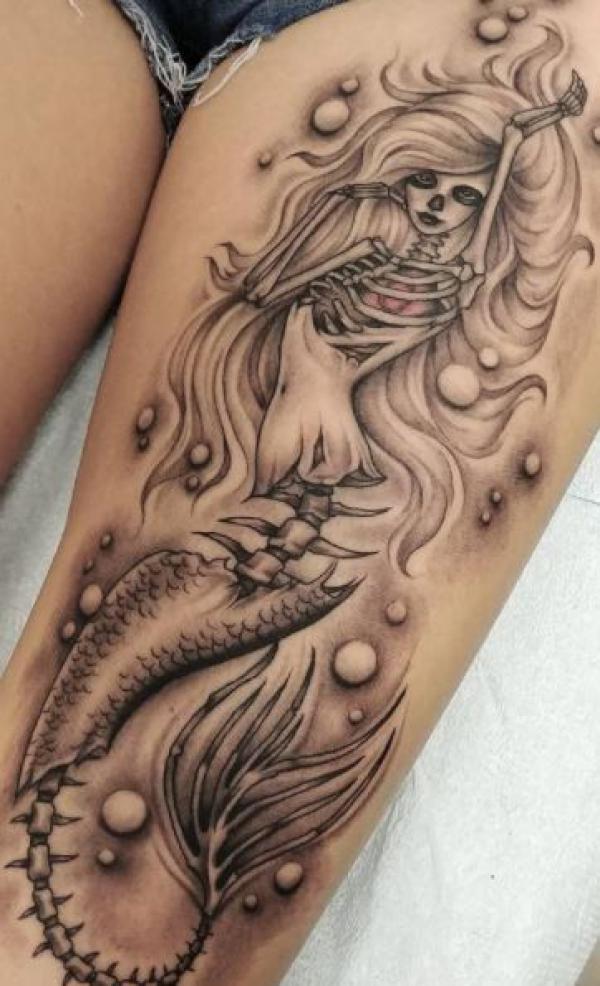 Mermaid thigh tattoo