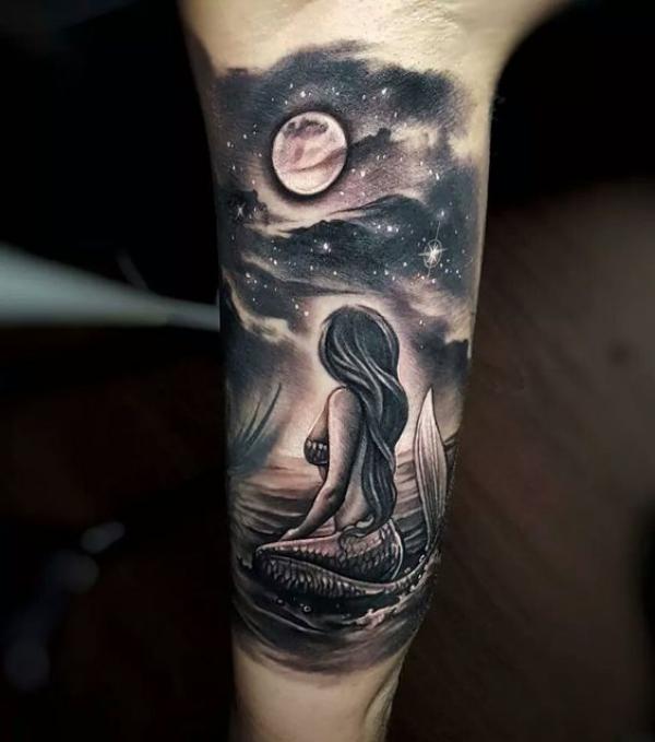 Mermaid under moon and stars tattoo