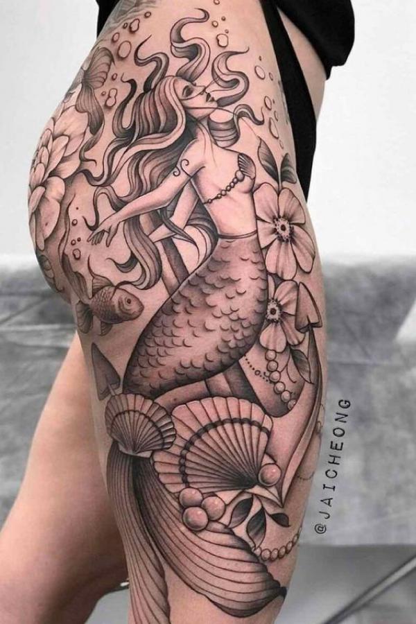 Mermaid with flowers fish and shell tattoo