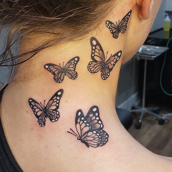 Monarch butterfly neck tattoo