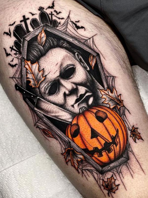 Pumpkin and Michael Myers thigh tattoo