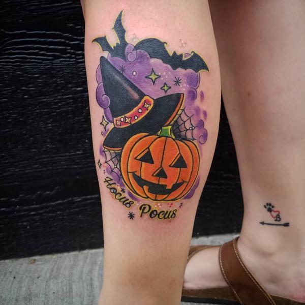 Pumpkin and magic hat with words Hocus Pocus