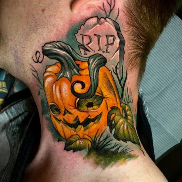Pumpkin with letters RIP neck tattoo