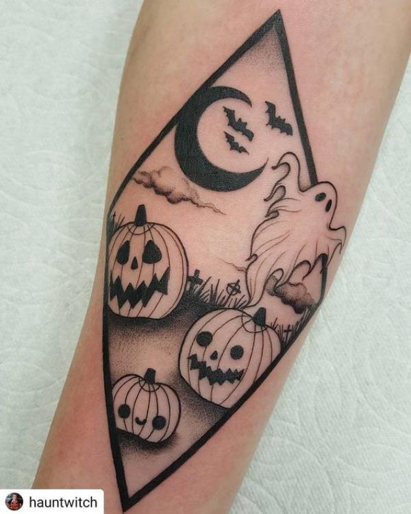 Pumpkins and a ghost under moon and bats