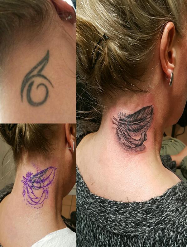 Realistic feather neck cover up tattoo