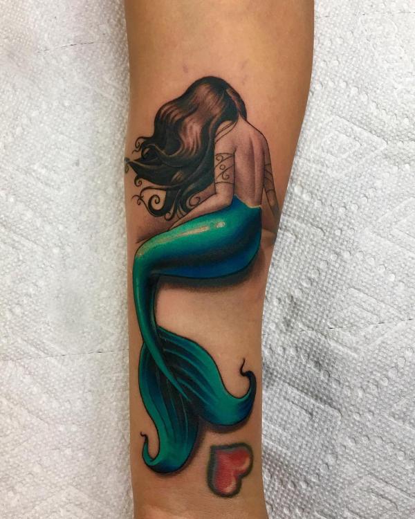 Realistic mermaid with love symbol