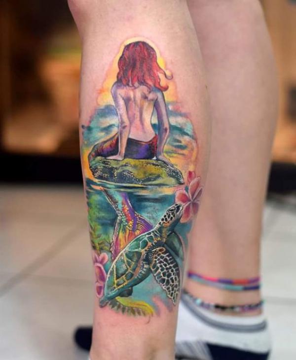 Realistic mermaid with sea turtle tattoo