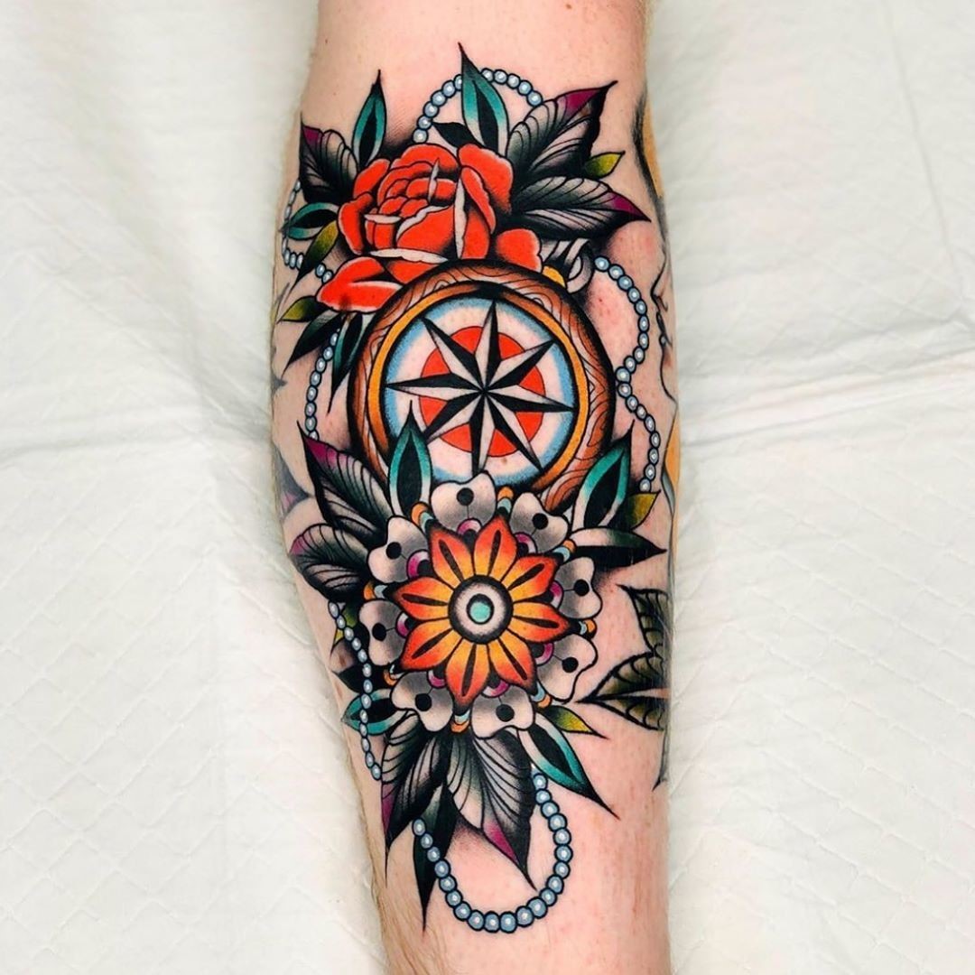Rose and steering wheel tattoo in old school style