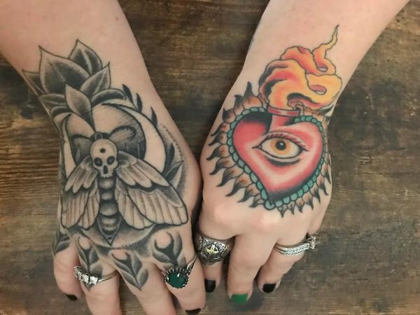 Sacred heart and death moth tattoo on hands
