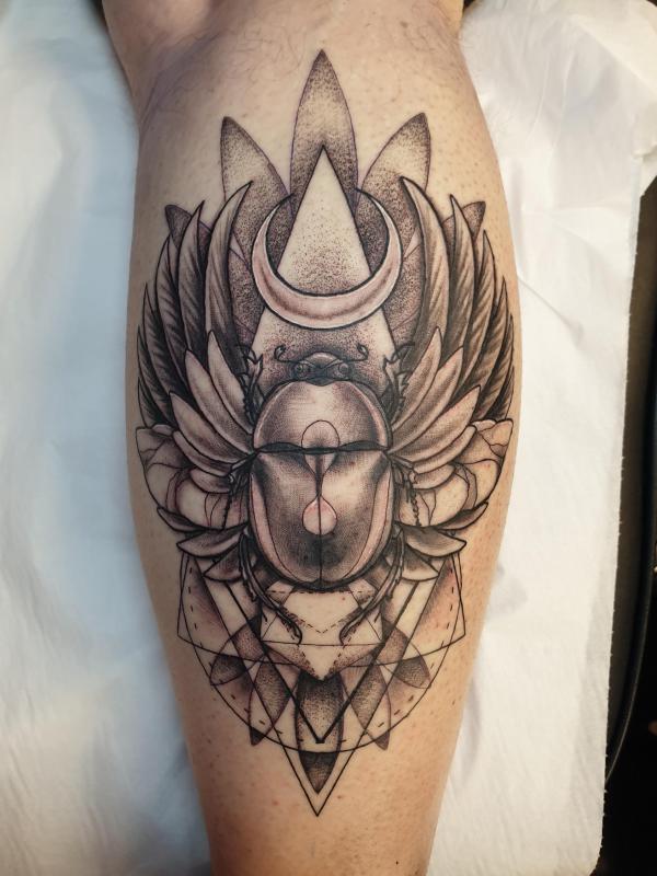 Scarab Beetle with feathers tattoo
