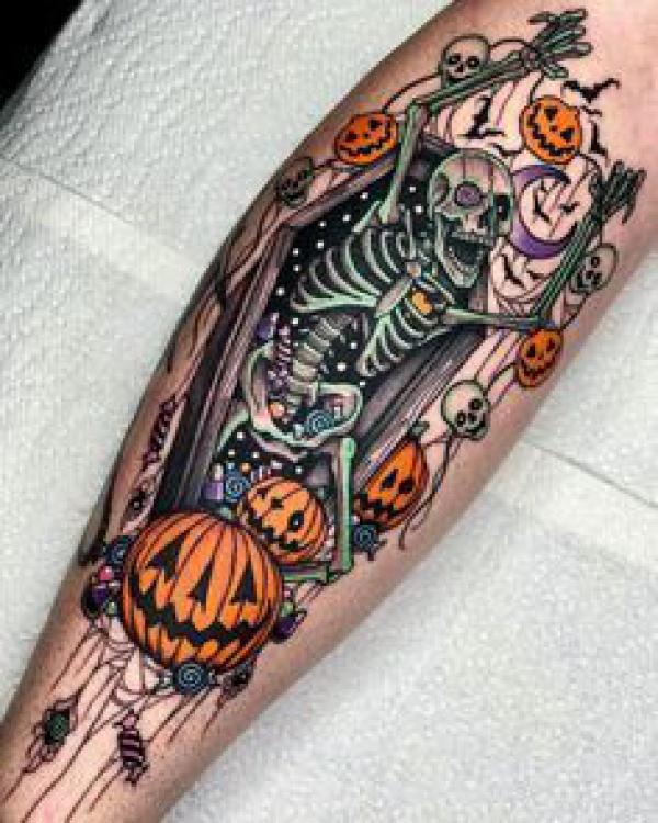Skeleton in coffin with pumpkins and skulls