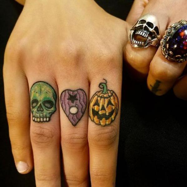 Skull heart pumpkin finger tattoo