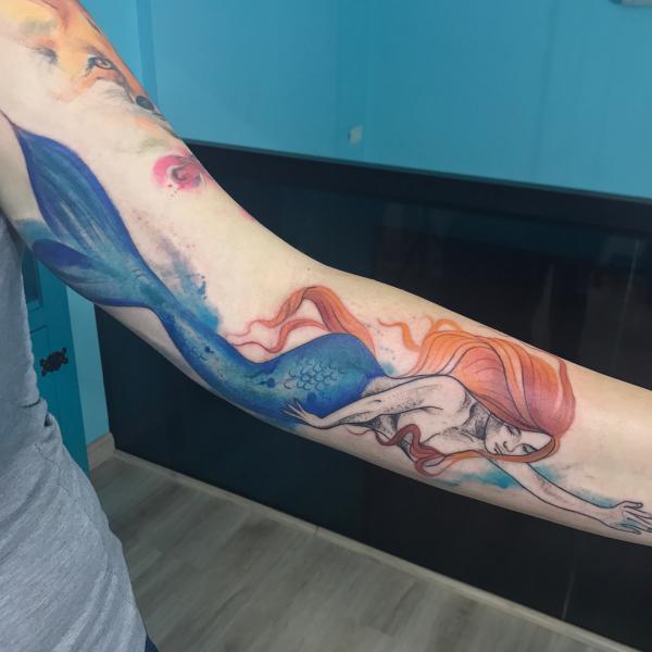 Swimming mermaid tattoo