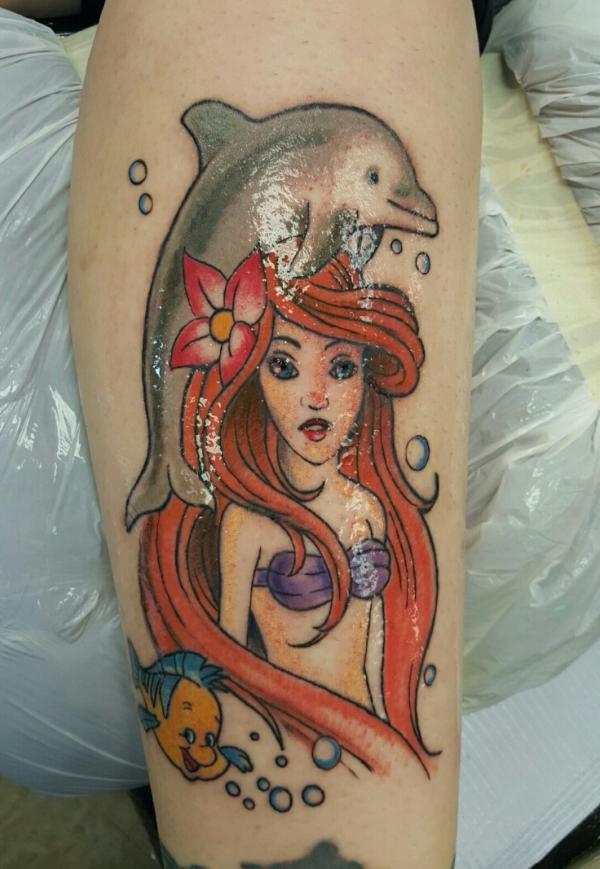 The Little Mermaid and dolphin tattoo