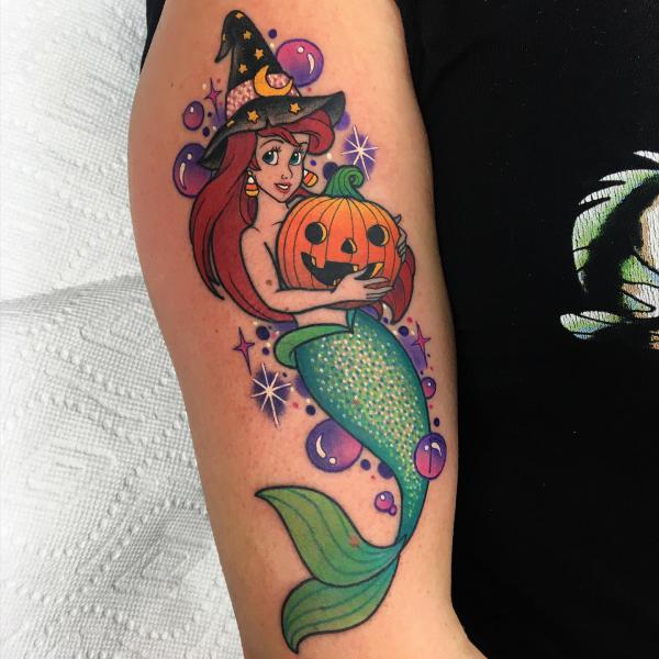 The little mermaid holding a pumpkin tattoo