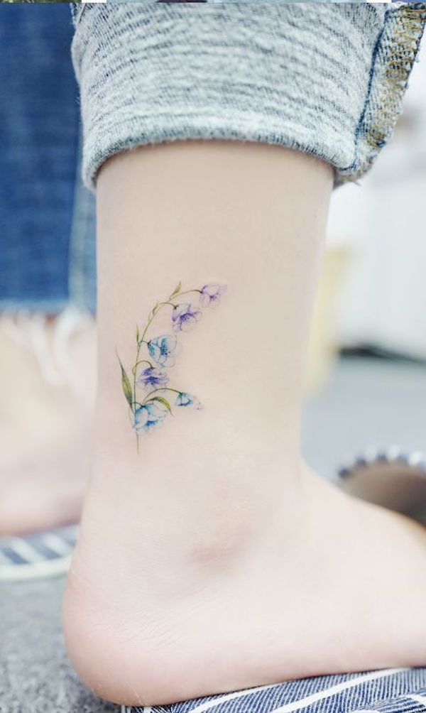 Impressive Flowers Vine Tattoo On Foot For Girls