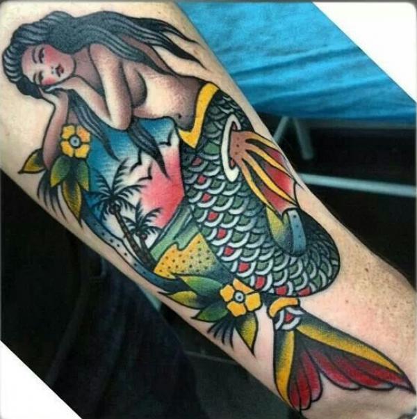 Traditional mermaid and palm tree tattoo