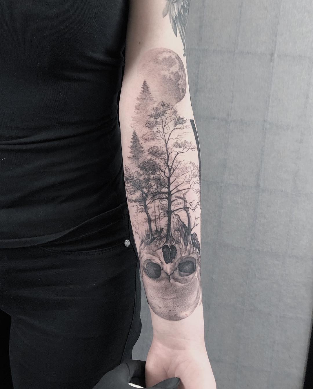 Trees growing out of skull half sleeve tattoo