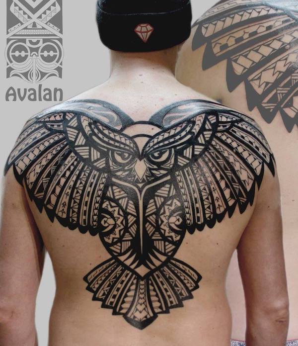 Tribal owl back tattoo