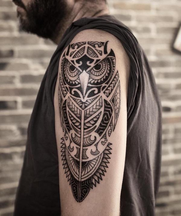 tribal owl arm tattoos