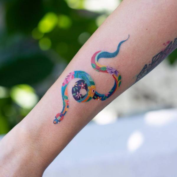 Watercolor snake forearm tattoo