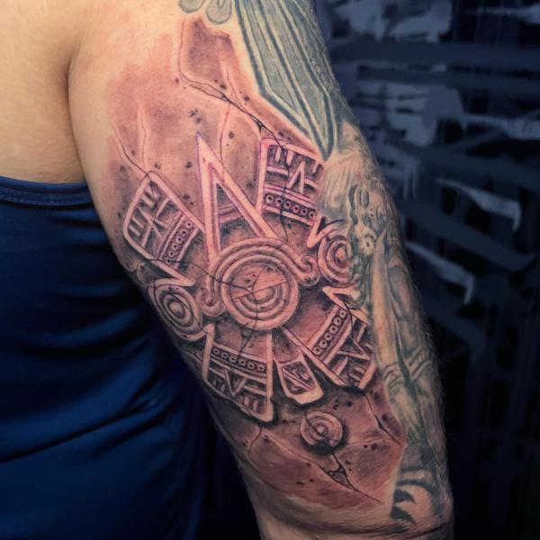 aztec ollin tattoo on upper arm