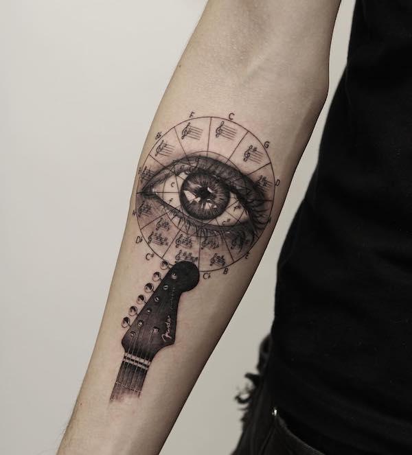 music eye forearm tattoo