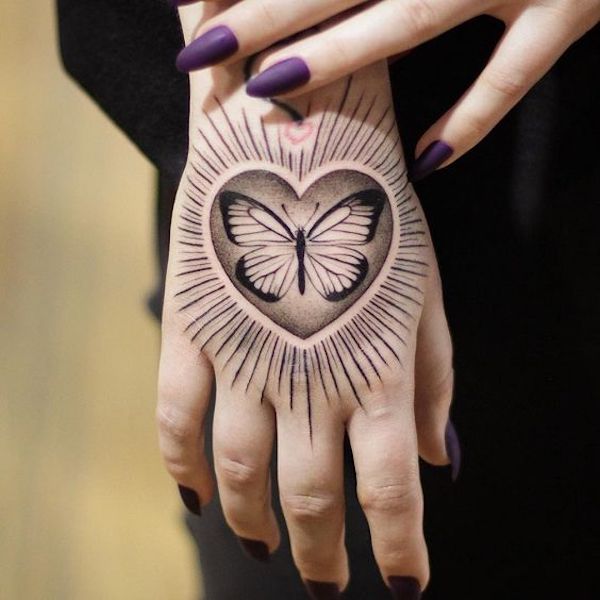 A butterfly in heart symbol with halo