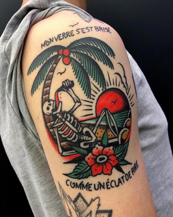 A skeleton drinking behind a Palm Tree at sunset