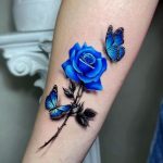 A stem blue rose with two butterflies