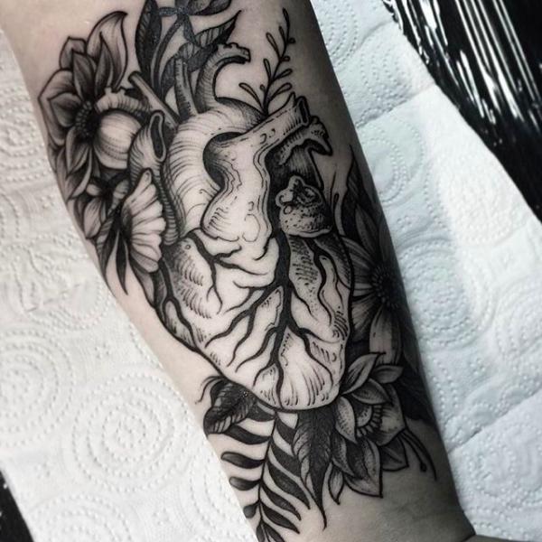 Anatomical heart with roots and flowers