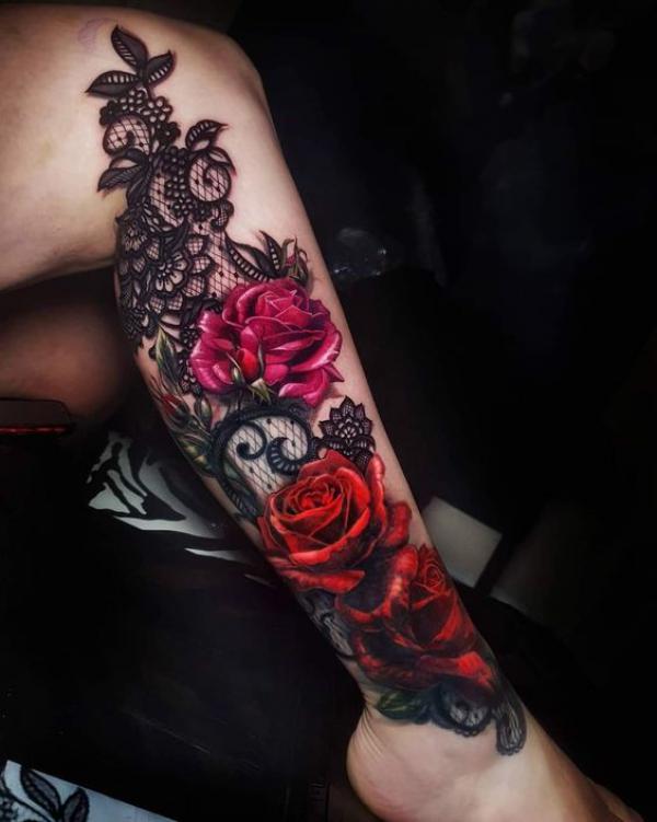 Black rose and red roses leg tattoo