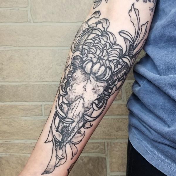 Bull skull wrapped in chrysanthemums