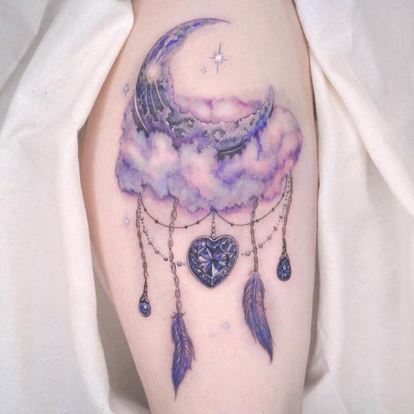 Crescent moon and stars above clouds with feather and heart pendant