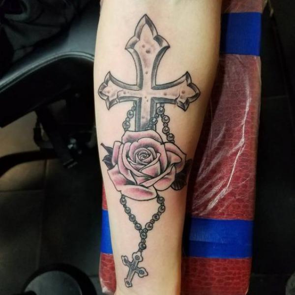 Cross with a rosary and a rose