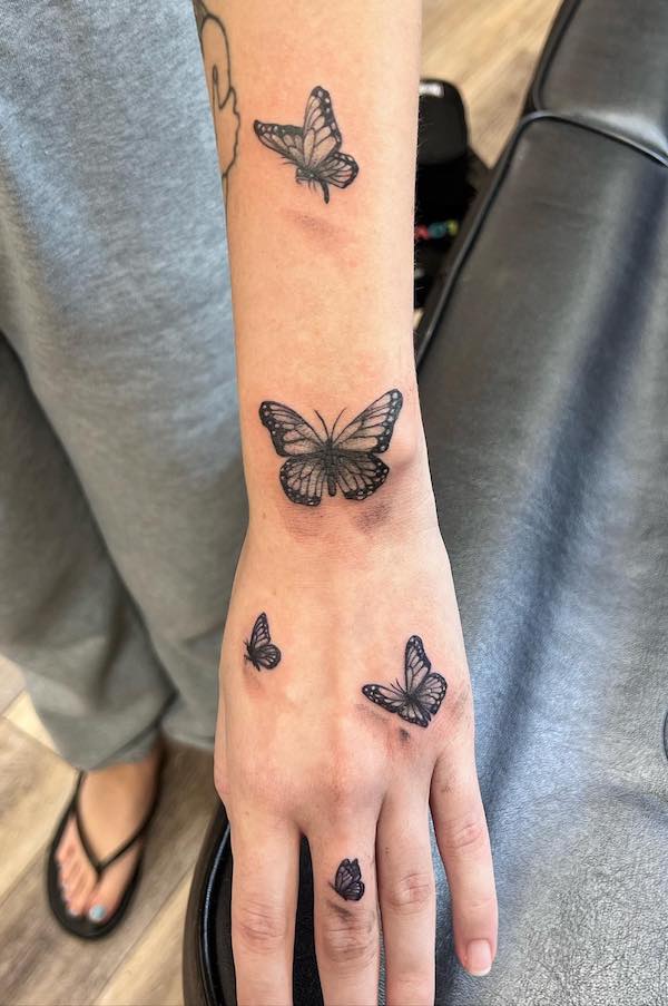 Cute butterflies on hand