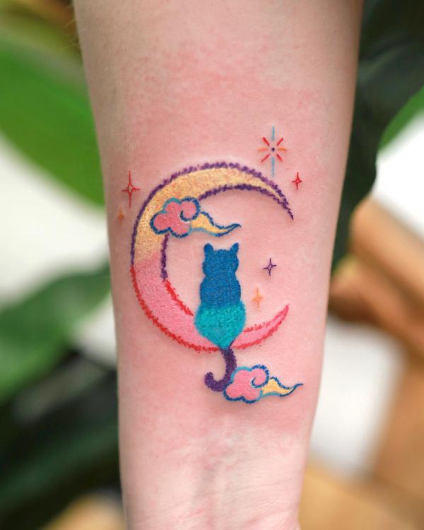 Cute cat sitting on crescent moon
