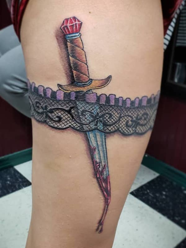Dagger and lace garter tattoo
