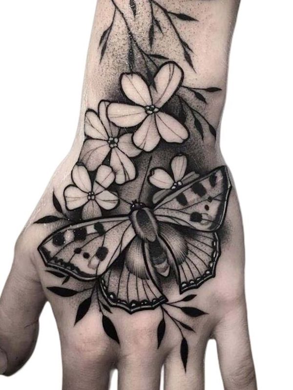 Floral Black butterfly hand tattoo
