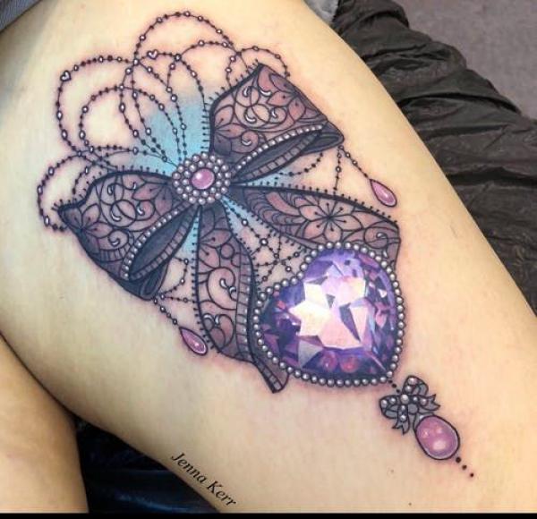 Bow and diamond tattoo
