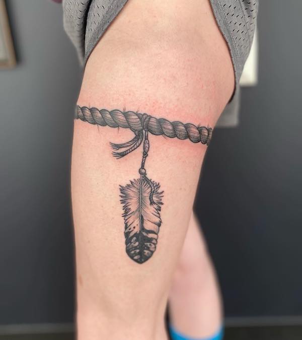 Feather garter tattoo